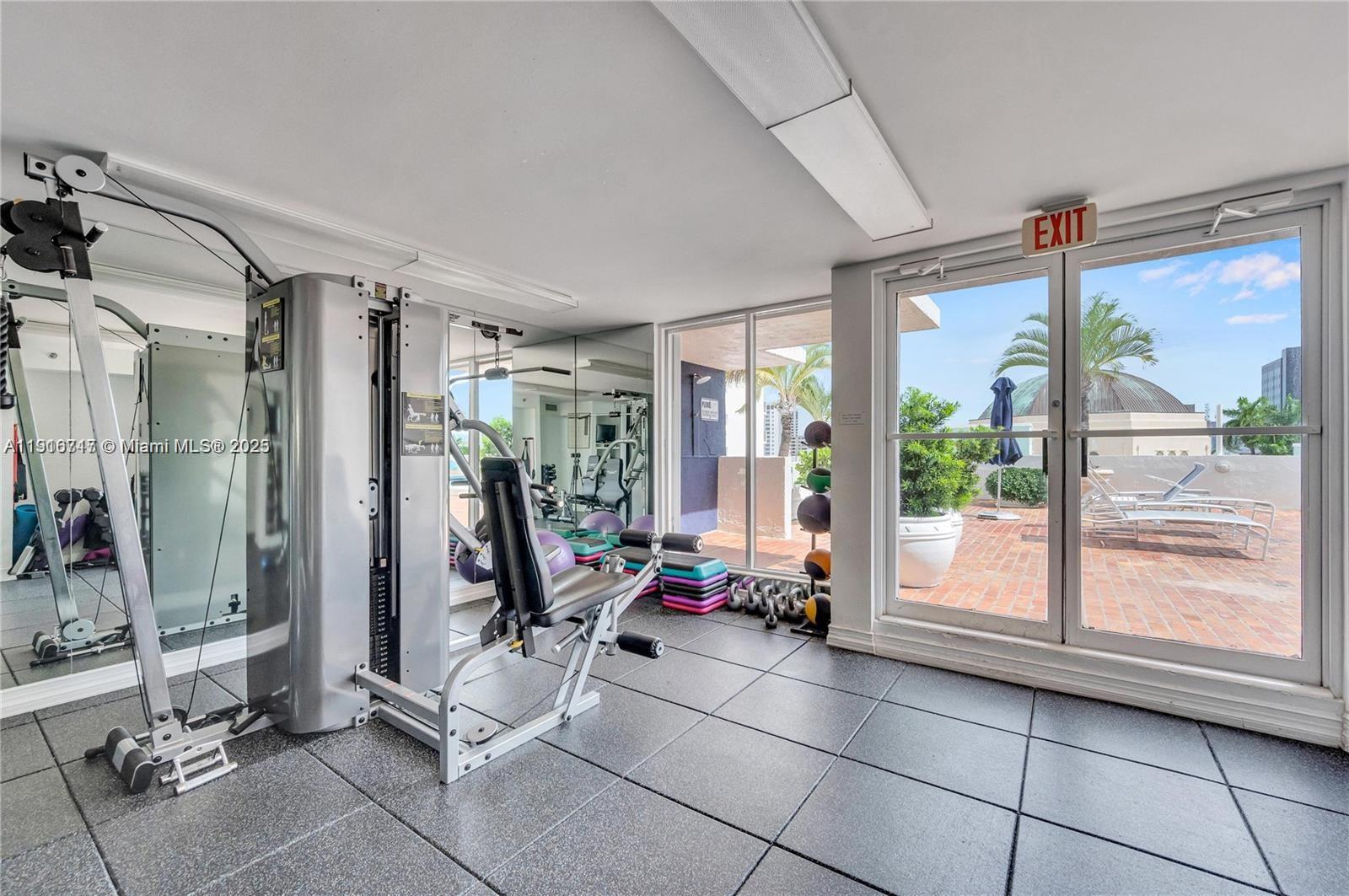 1775 Washington Avenue, Unit 4G Miami Beach, FL 33139 - Photo 11 of 44 a view of a room with gym equipment