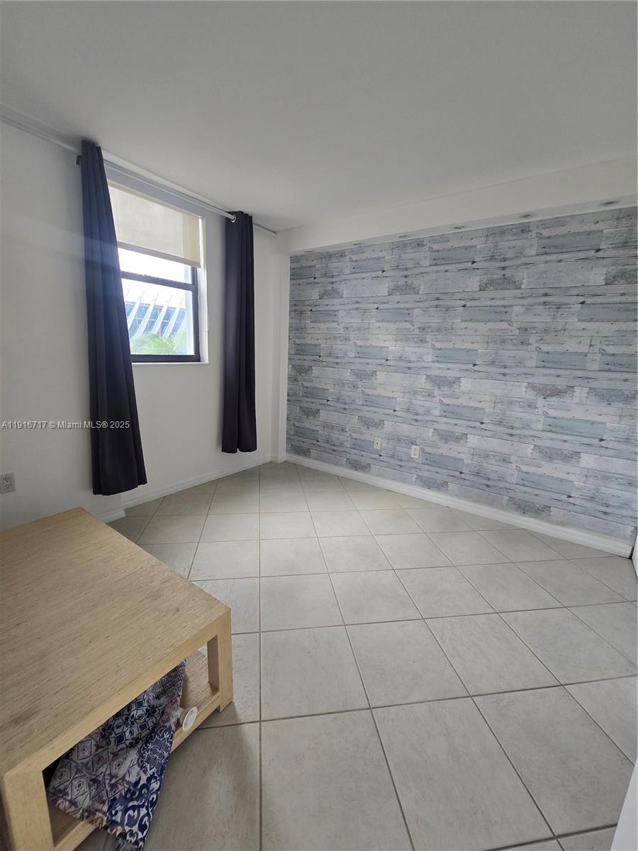 1775 Washington Avenue, Unit 4G Miami Beach, FL 33139 - Photo 15 of 44 a view of an empty room and window