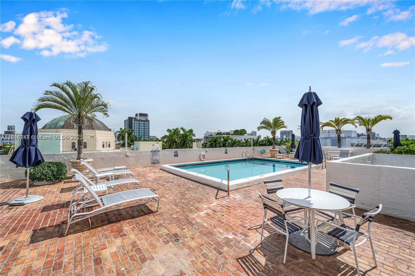 1775 Washington Avenue, Unit 4G Miami Beach, FL 33139 - Photo 2 of 44 a view of a terrace with sitting area