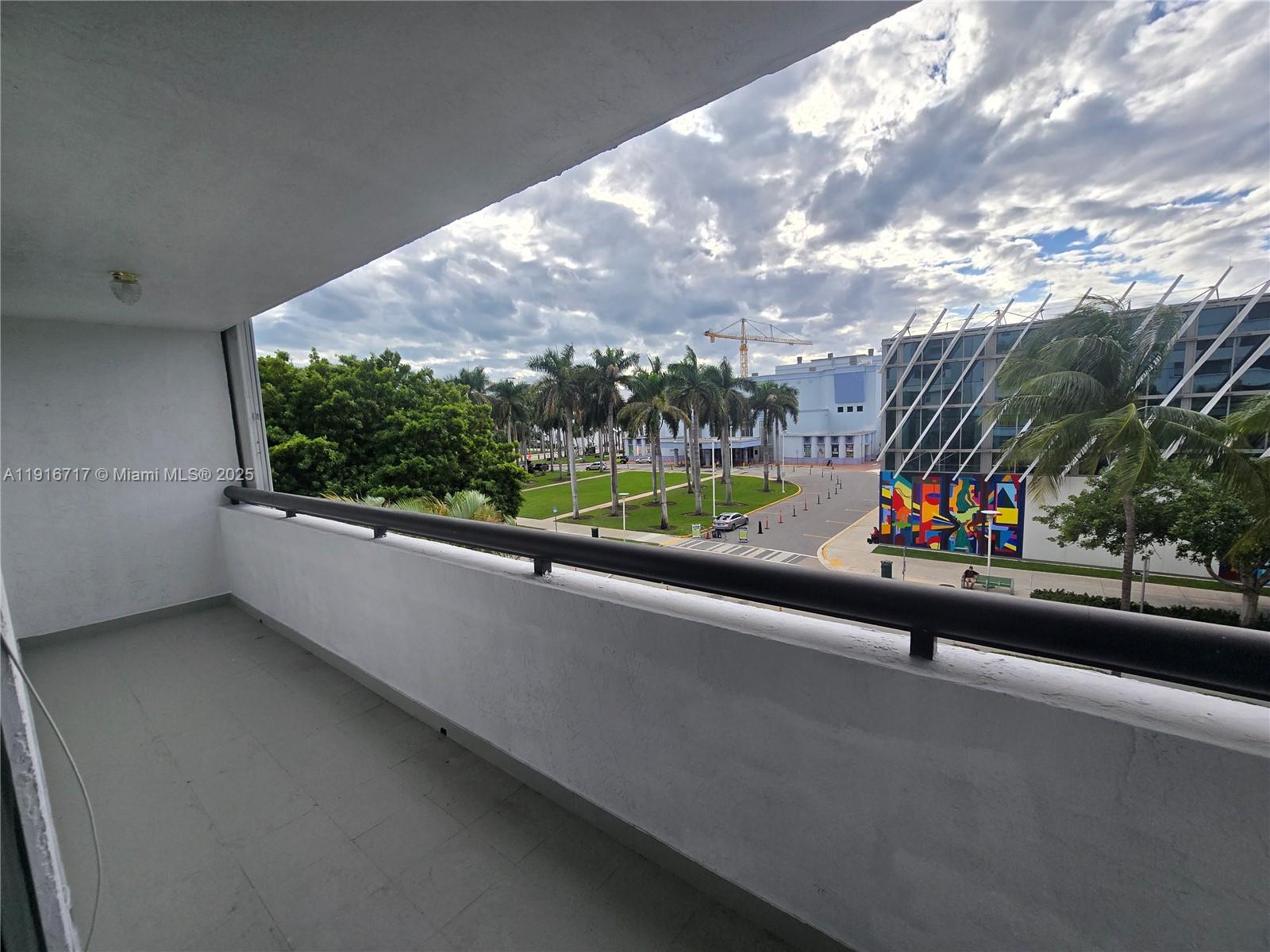 1775 Washington Avenue, Unit 4G Miami Beach, FL 33139 - Photo 21 of 44 a view of a street with a cars parked in front of it