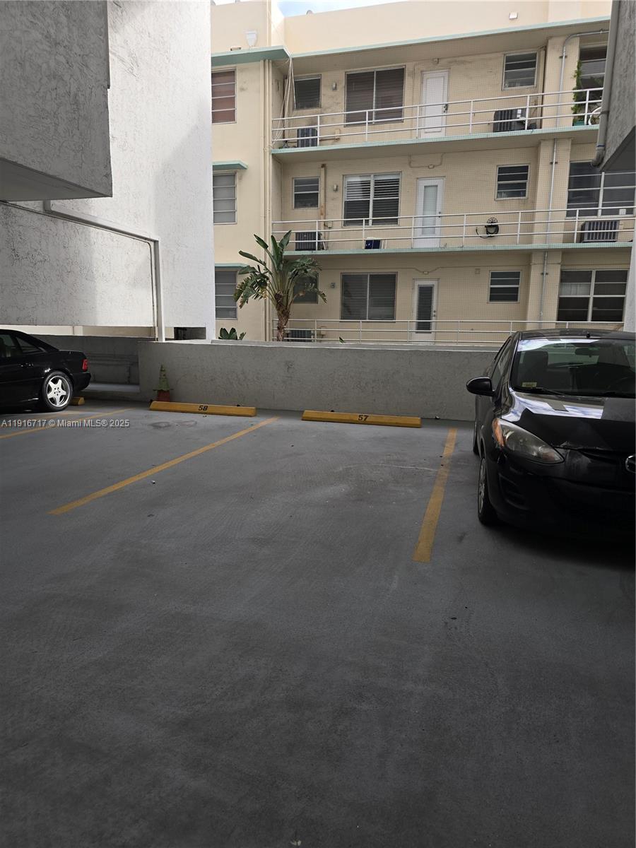 1775 Washington Avenue, Unit 4G Miami Beach, FL 33139 - Photo 24 of 44 a car parked in front of a building