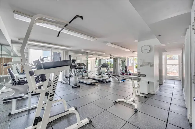 a living room with lots of furniture and white walls