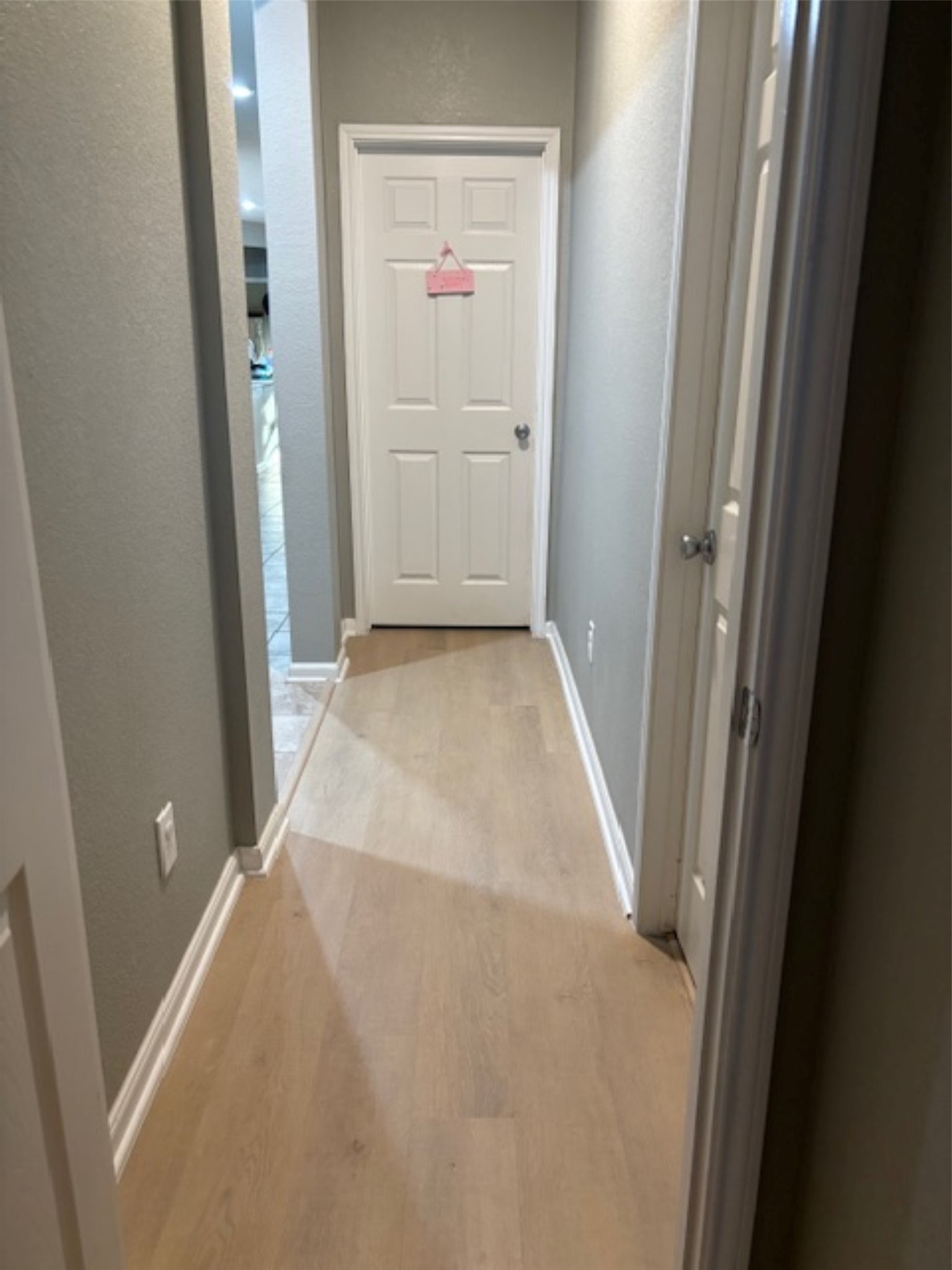 1118 Upton Court Conroe, TX 77304 - Photo 9 of 25 Hallway between both bedrooms with new floors!