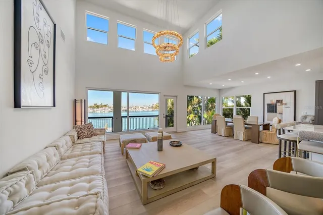 a bedroom with a large bed and a flat screen tv