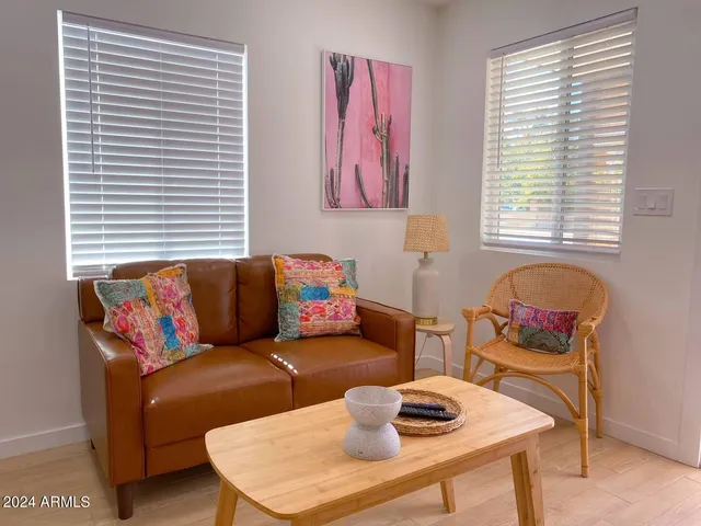 a living room with furniture and a window