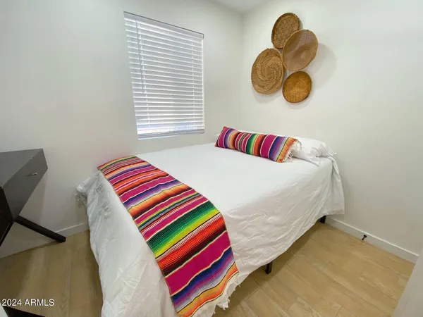 a bedroom with a bed and window