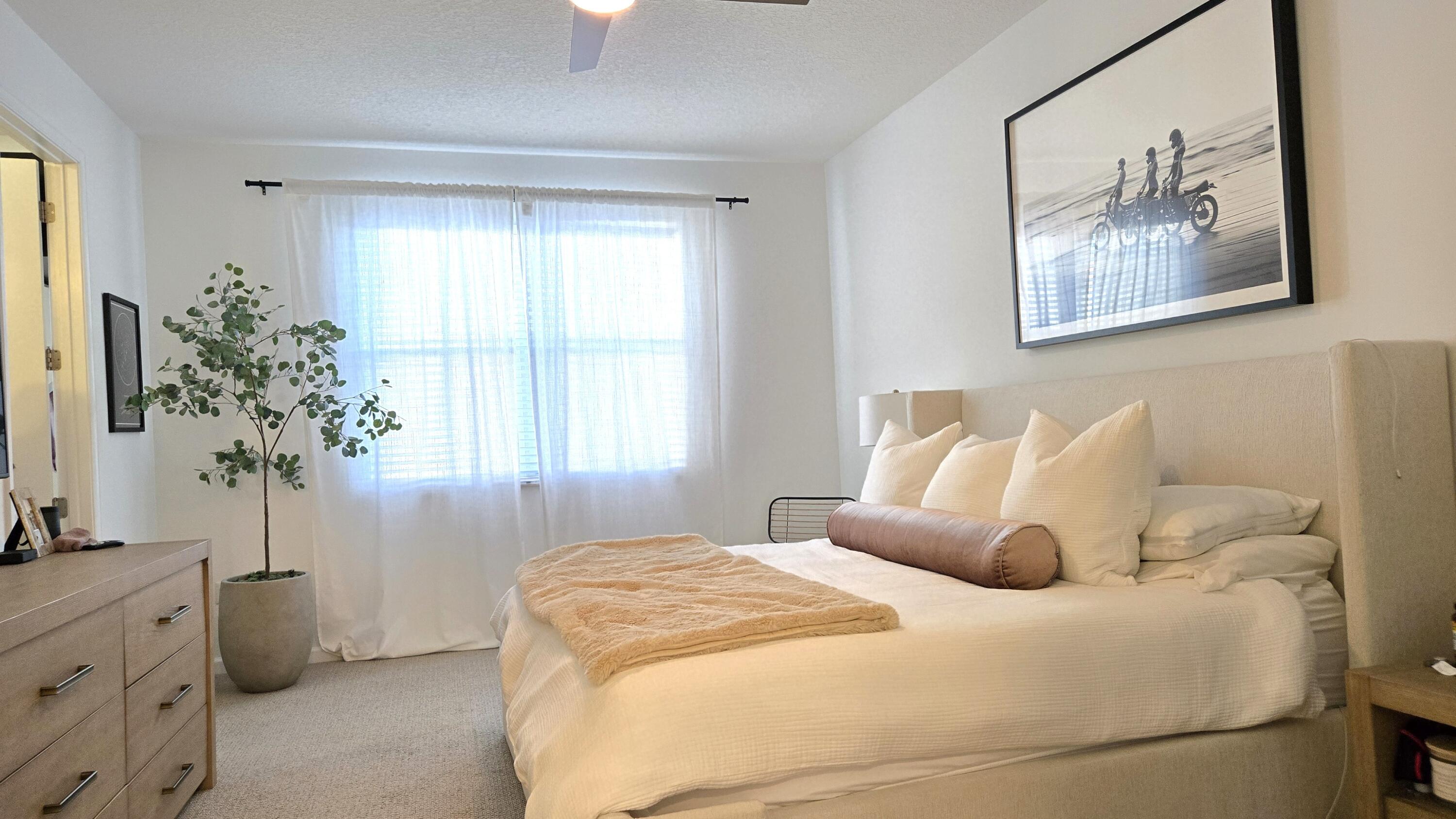 4858 Northwest 16th Terrace Boca Raton, FL 33431 - Photo 12 of 38 a bedroom with bed and window