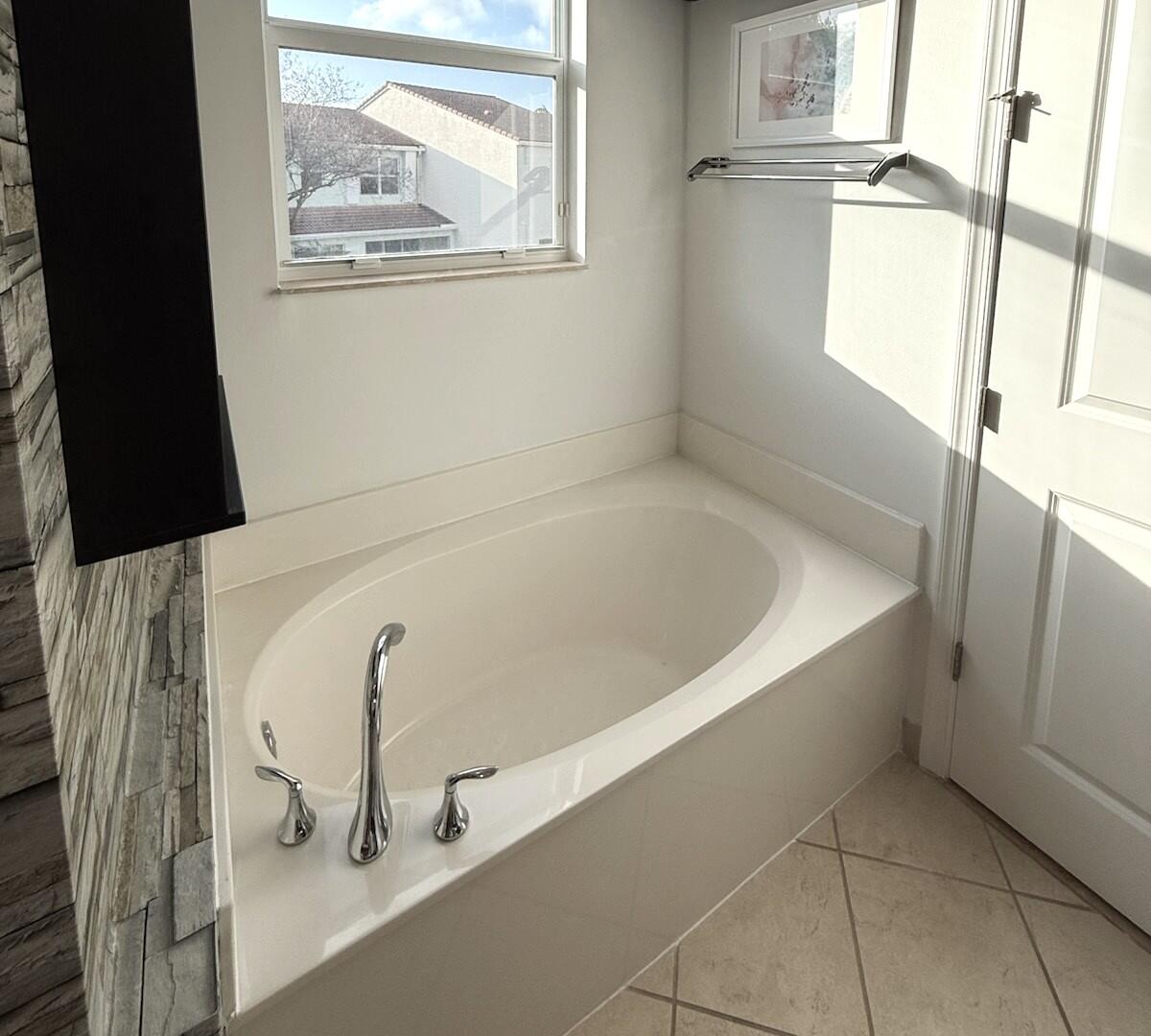 4858 Northwest 16th Terrace Boca Raton, FL 33431 - Photo 14 of 38 a bathroom with a bathtub