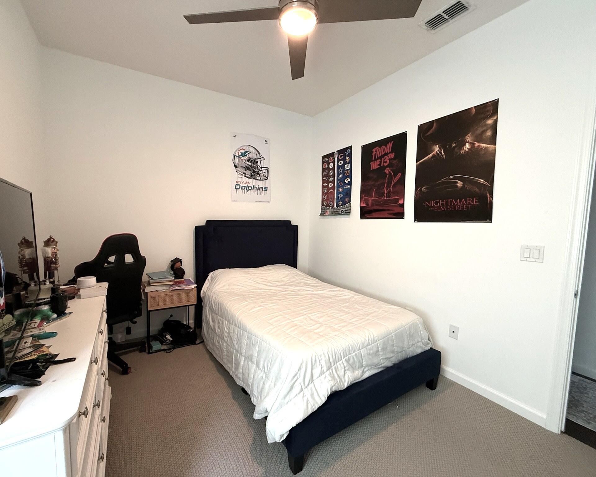4858 Northwest 16th Terrace Boca Raton, FL 33431 - Photo 17 of 38 a bedroom with a bed and dresser