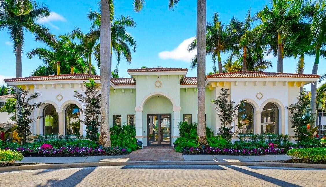 4858 Northwest 16th Terrace Boca Raton, FL 33431 - Photo 26 of 38 a front view of a house with a garden