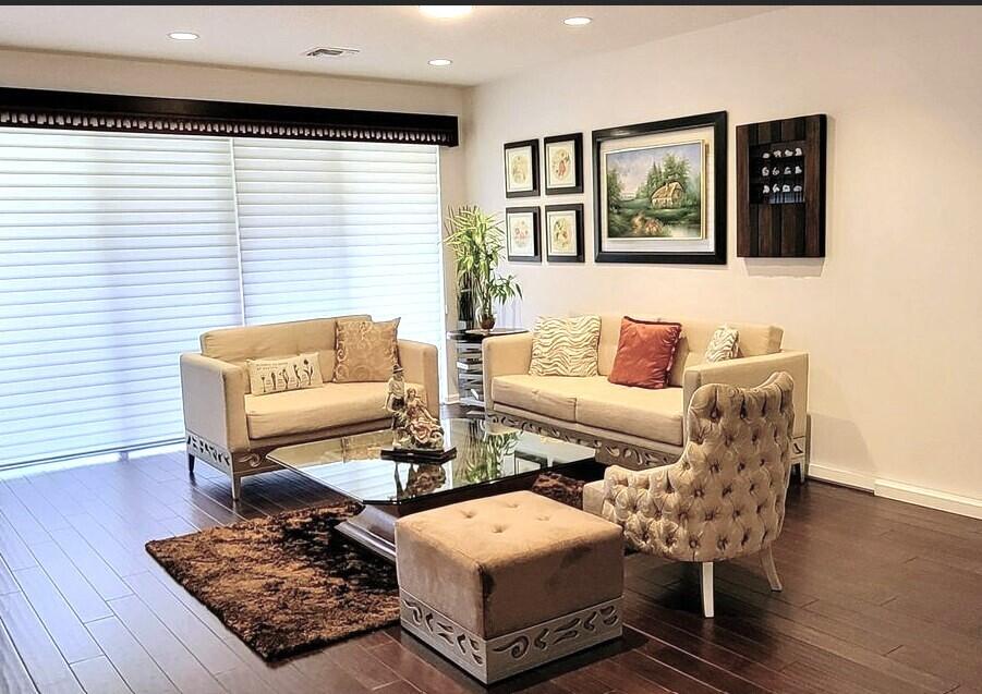 4858 Northwest 16th Terrace Boca Raton, FL 33431 - Photo 4 of 38 a living room with furniture and wooden floor