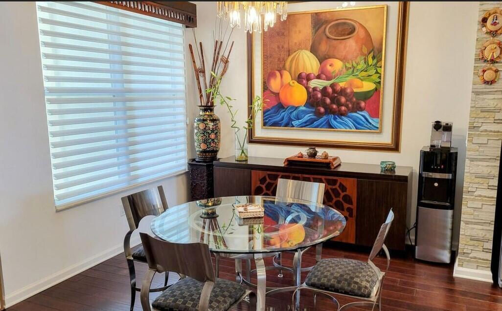 4858 Northwest 16th Terrace Boca Raton, FL 33431 - Photo 8 of 38 a view of a dining room with furniture and wooden floor