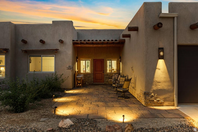 2925 Juniper Road Enterprise, UT 84725 - Photo 2 of 56 Property entrance featuring a patio area, stucco siding, and stone siding