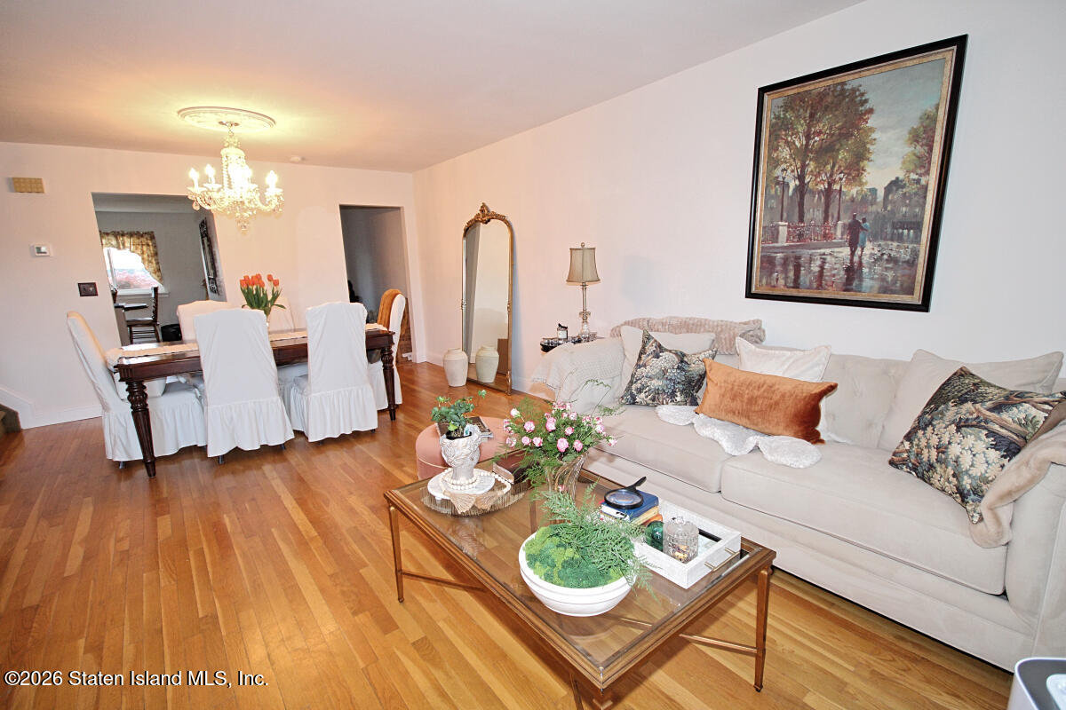 951 West Fingerboard Road Staten Island, NY 10304 - Photo 4 of 29 a living room with furniture and wooden floor