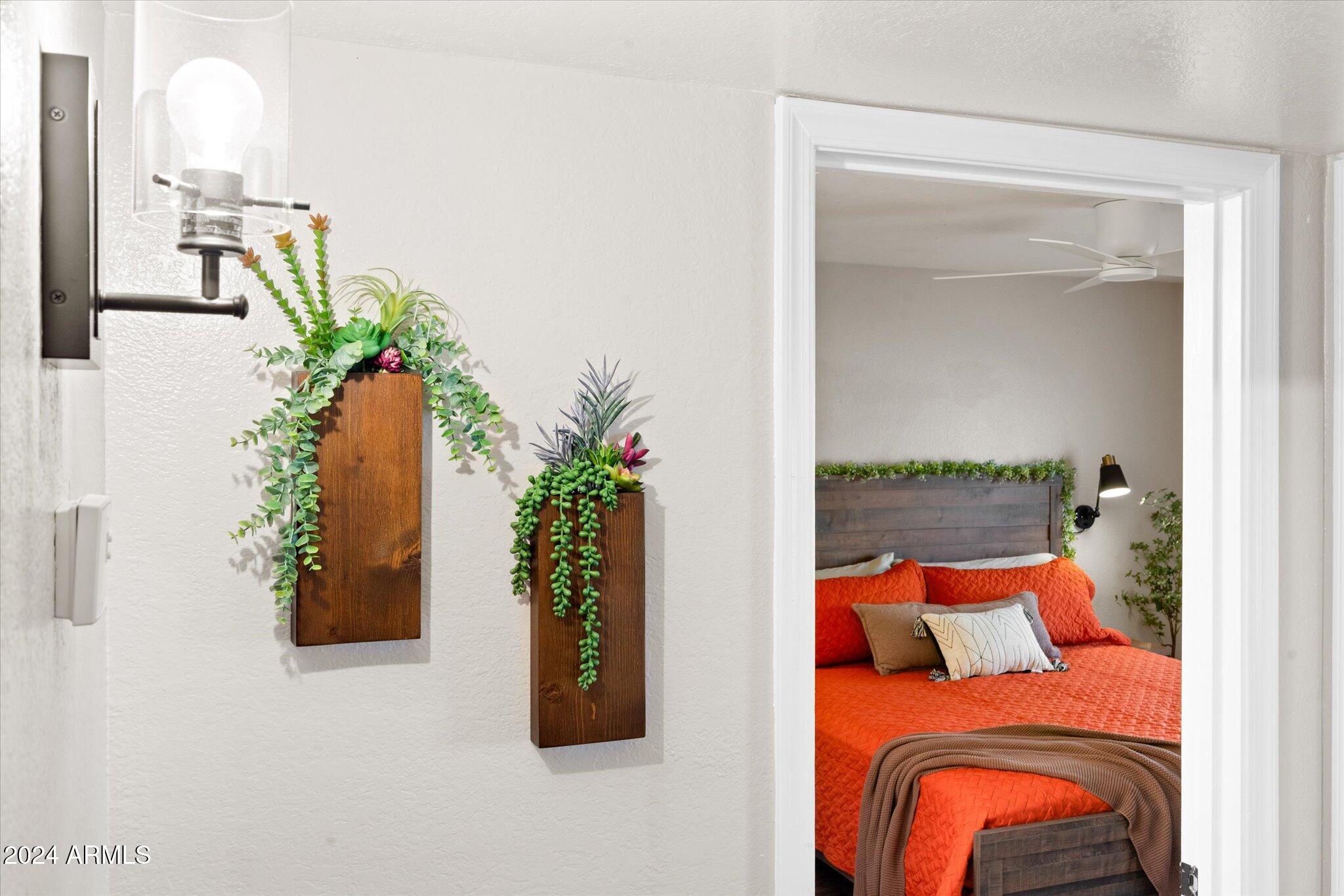 533 West Guadalupe Road, Unit 1063 Mesa, AZ 85210 - Photo 25 of 57 a bedroom with a bed and a potted plant