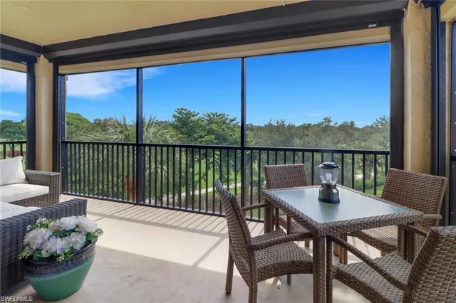 a view of a chairs and table in patio