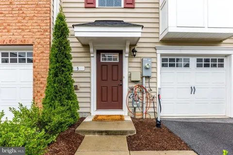a front view of a house with a porch