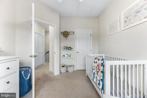 a view of a hallway with the wooden cabinets