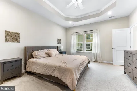 a bed room with a bed and a dresser