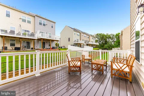 a view of backyard with swimming pool and patio