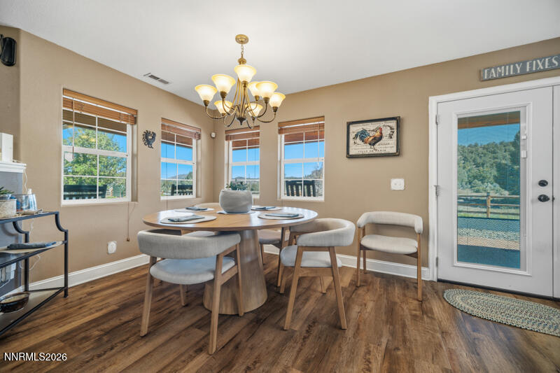 1931 Lousetown Road Reno, NV 89521 - Photo 7 of 51 a view of a dining room with furniture wooden floor and chandelier