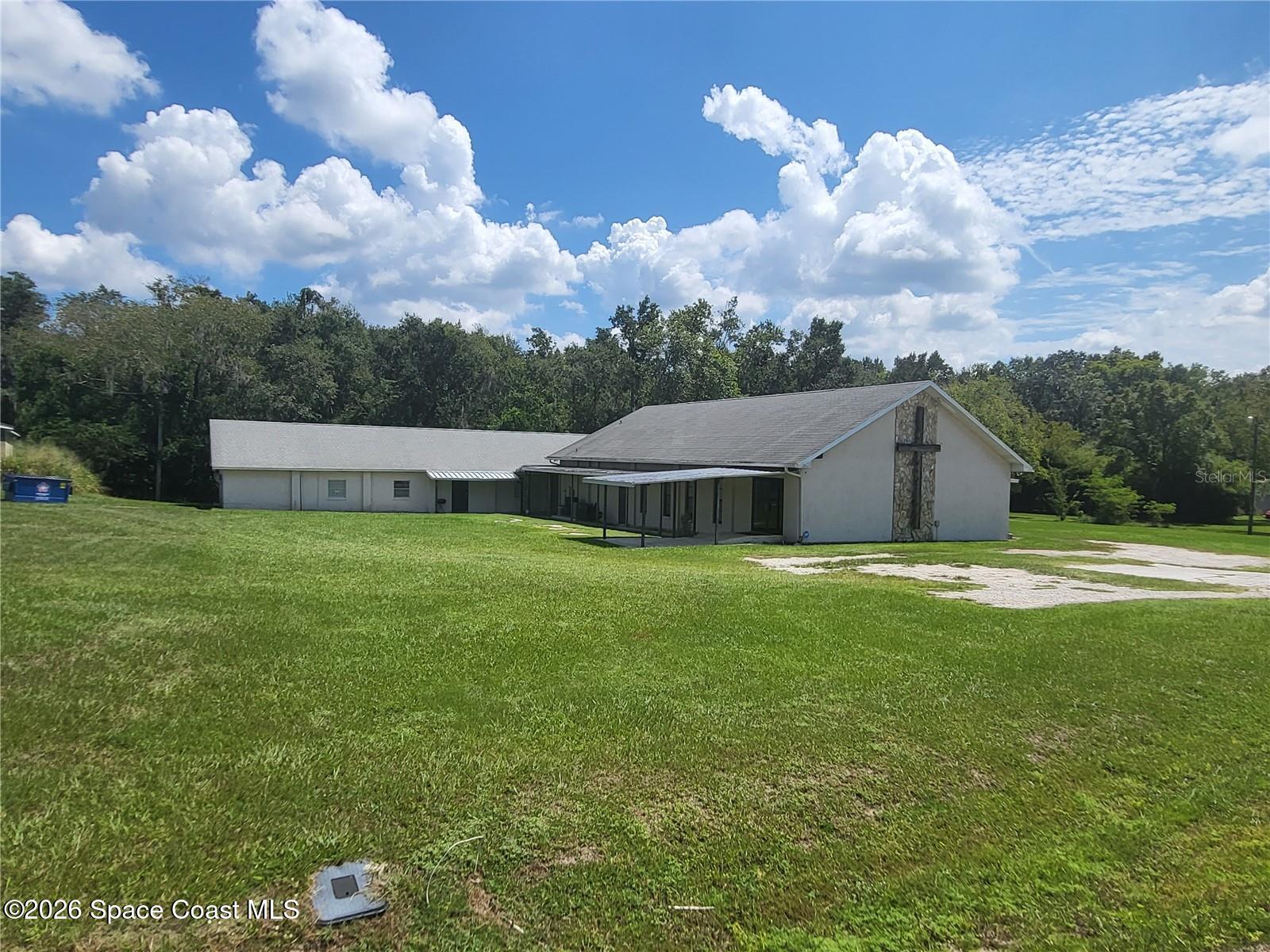 a front view of house with yard and entertaining space