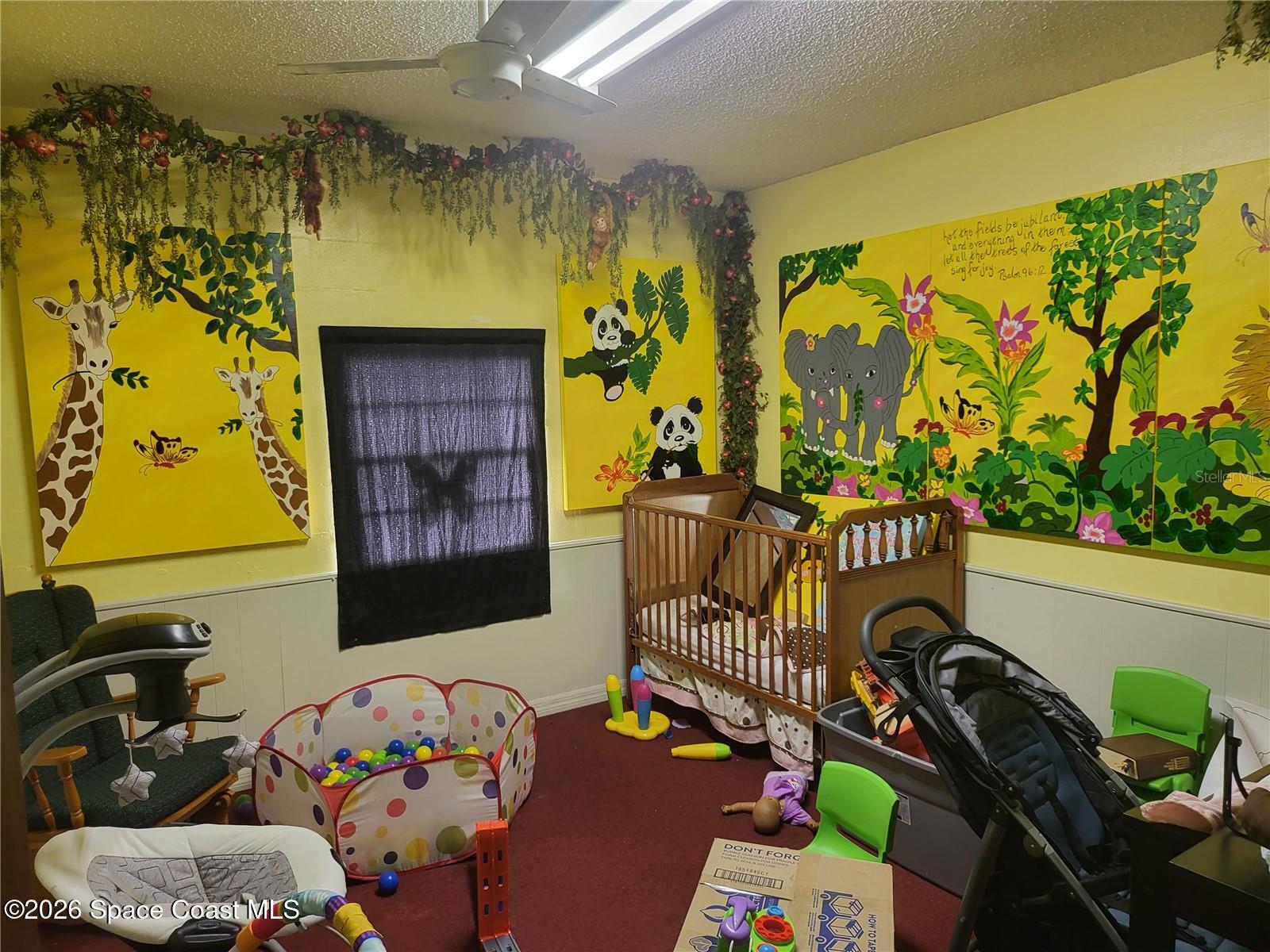 4626 Pipkin Road South Lakeland, FL 33811 - Photo 14 of 17 a bedroom with a bed a couch and a painting on the wall