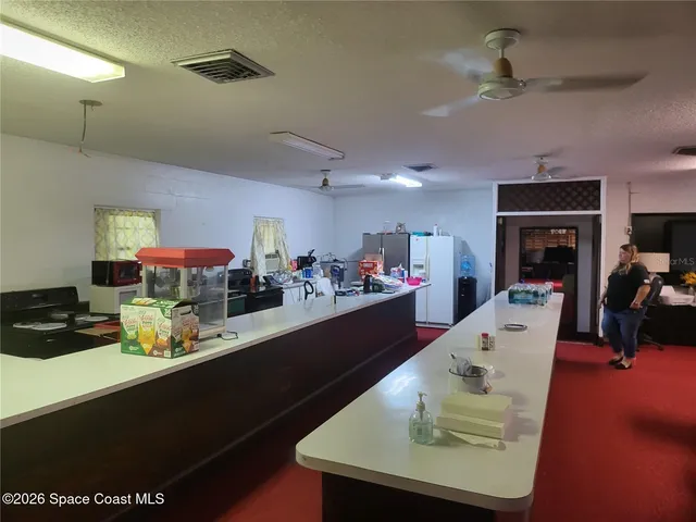 a kitchen with a sink cabinets and appliances
