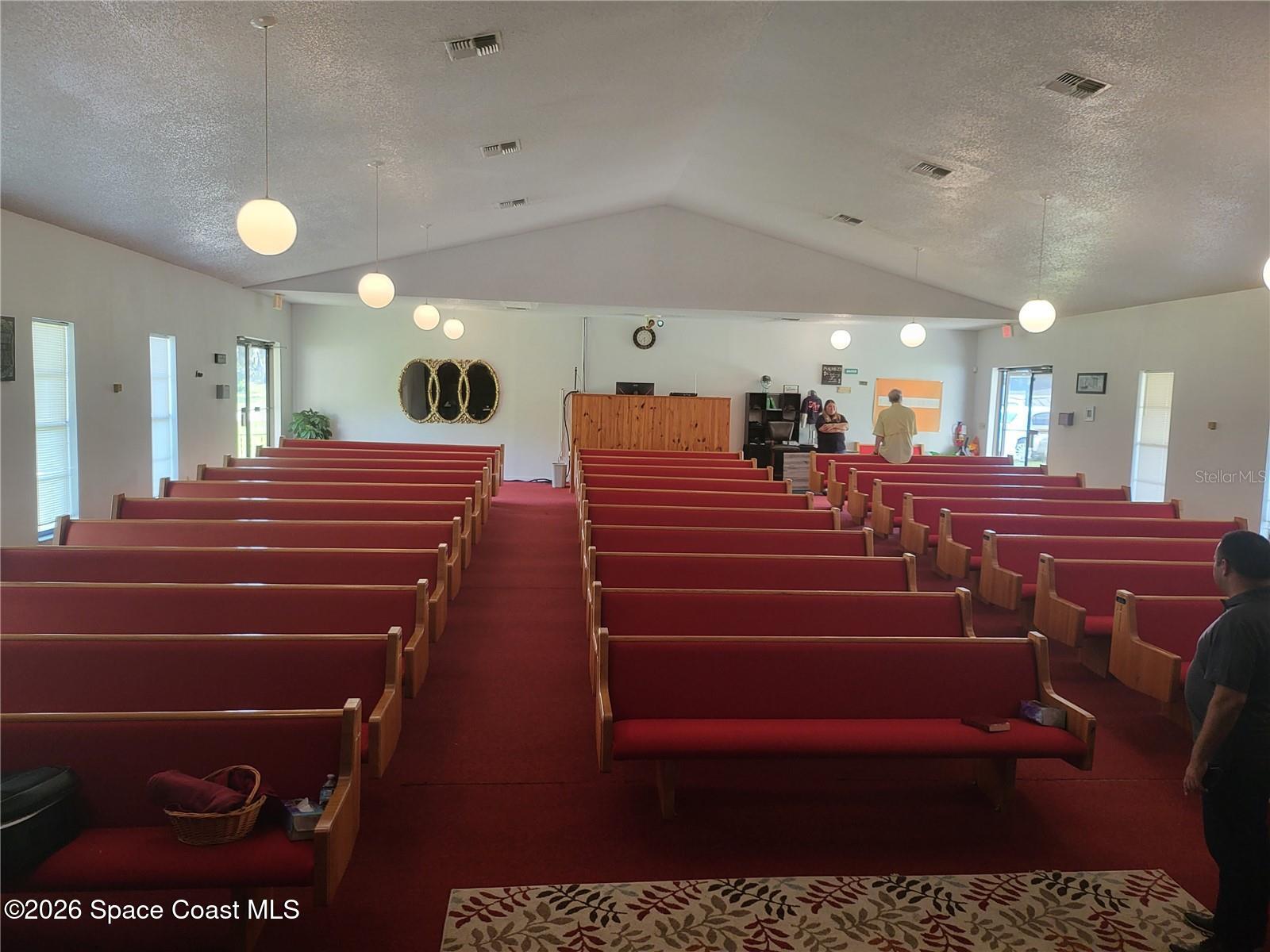 4626 Pipkin Road South Lakeland, FL 33811 - Photo 8 of 17 a room with lots of white furniture and a chandelier