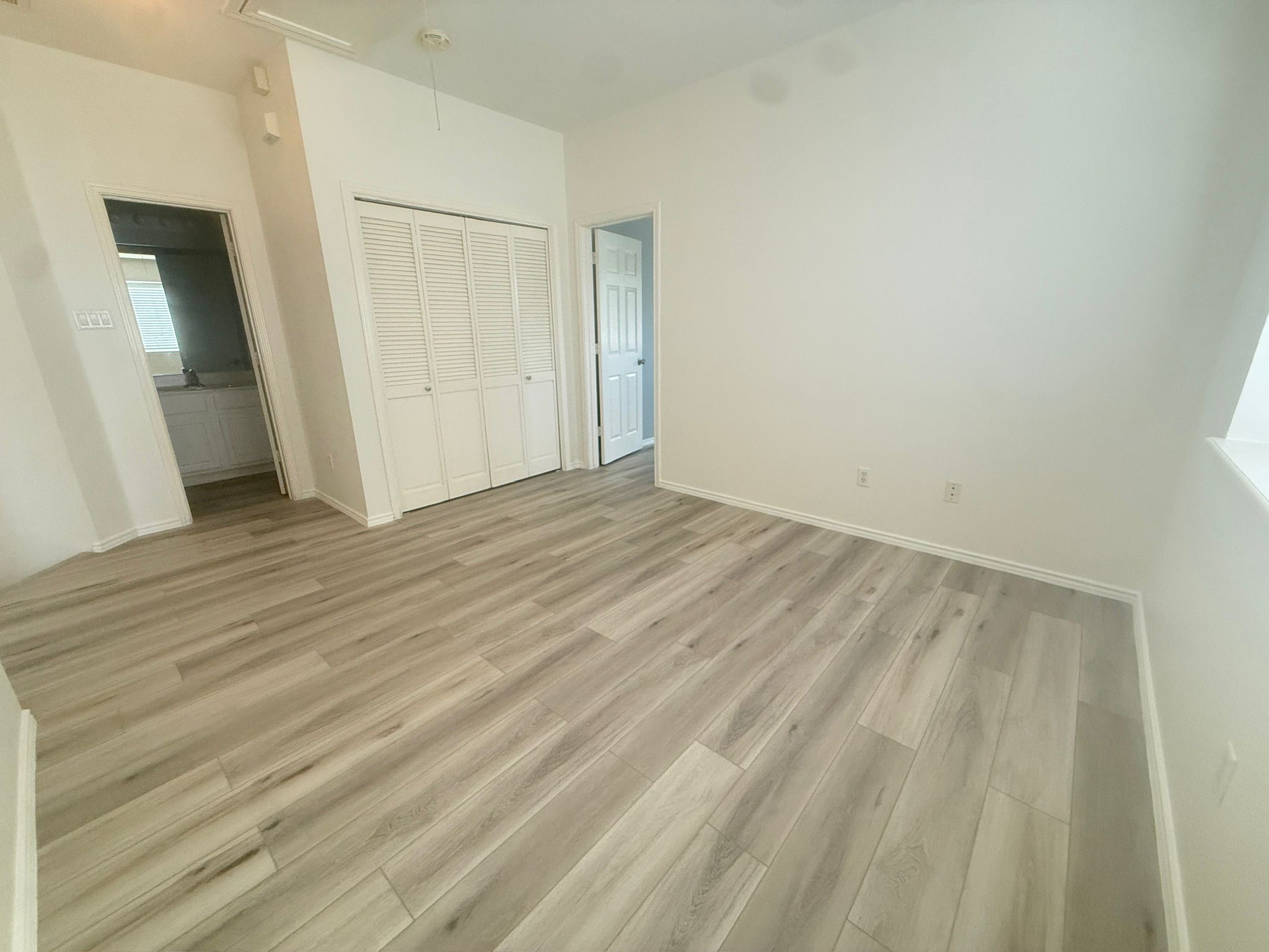 1900 Scofield Ridge Parkway, Unit 2103 Austin, TX 78727 - Photo 17 of 35 Upstairs loft with view to laundry closet and second bathroom.