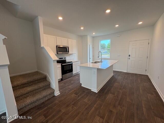 84 Montellano Road St. Augustine, FL 32084 - Photo 12 of 55 a kitchen with sink microwave and stove