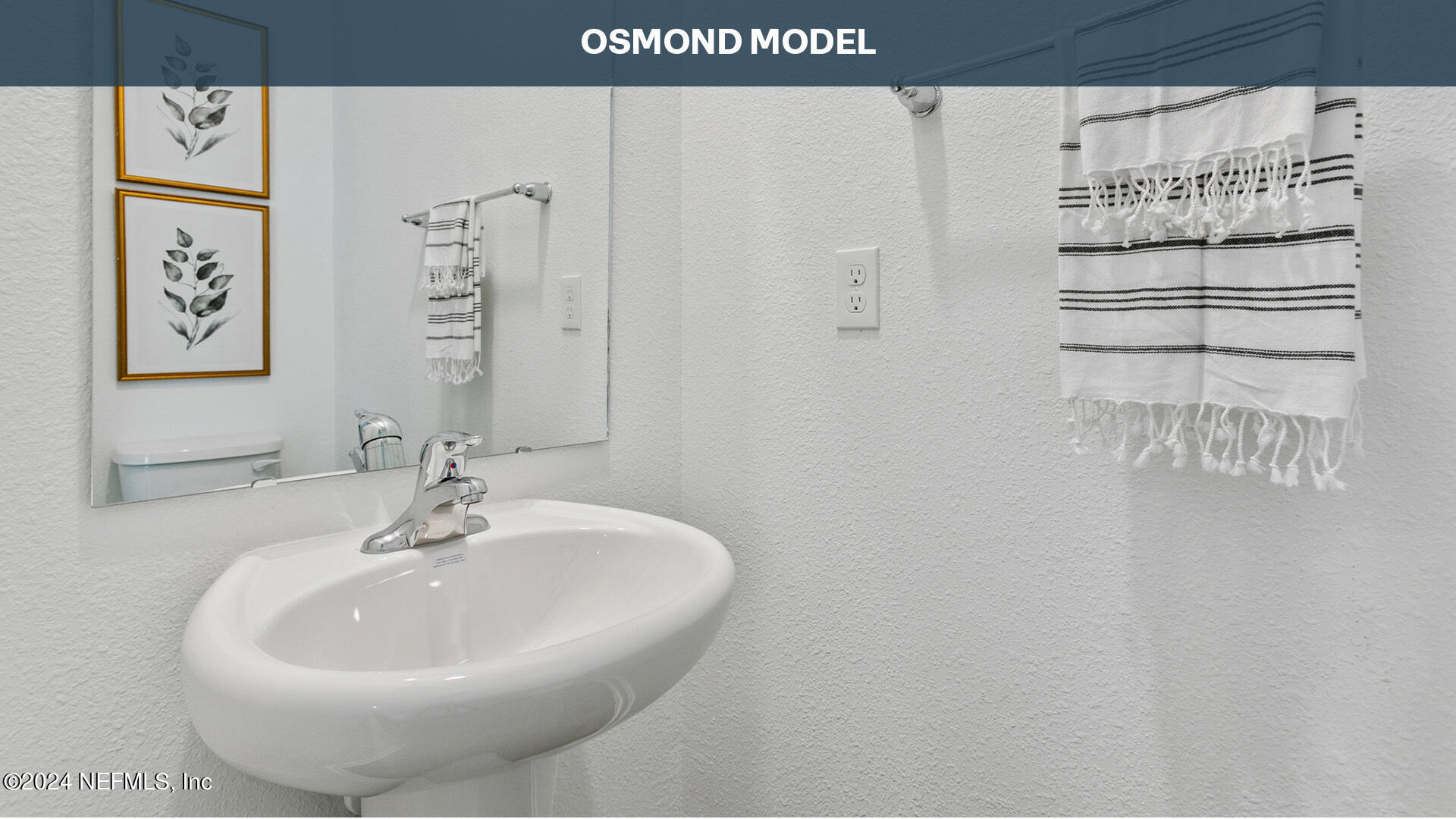 84 Montellano Road St. Augustine, FL 32084 - Photo 20 of 55 a bathroom with a sink and a mirror