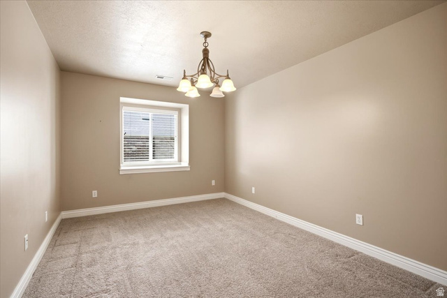 1089 West 2325th Street North Layton, UT 84041 - Photo 24 of 40 Neutral tone walls with white trim and a textured ceiling