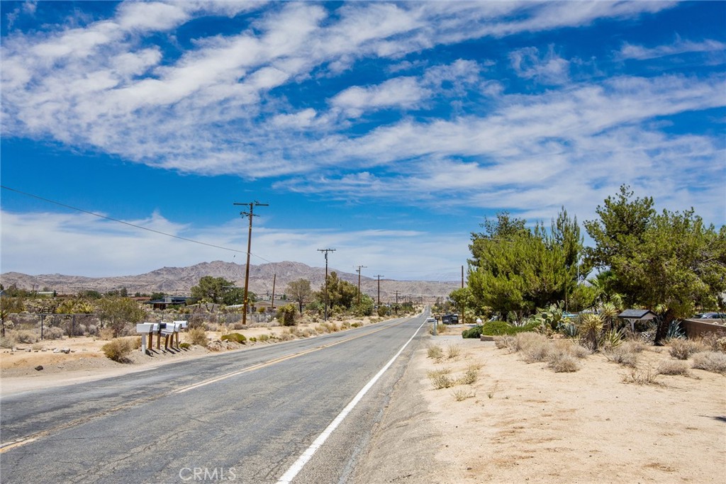 7800 Sunset Road Joshua Tree, CA 92252 - Photo 11 of 15 a view of a terrace with a bench