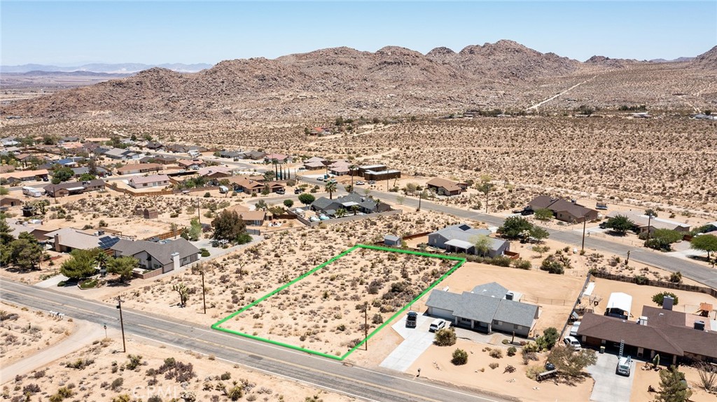 7800 Sunset Road Joshua Tree, CA 92252 - Photo 3 of 15 an aerial view of residential house and sandy dunes