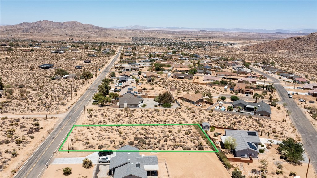 7800 Sunset Road Joshua Tree, CA 92252 - Photo 4 of 15 an aerial view of residential houses with outdoor space