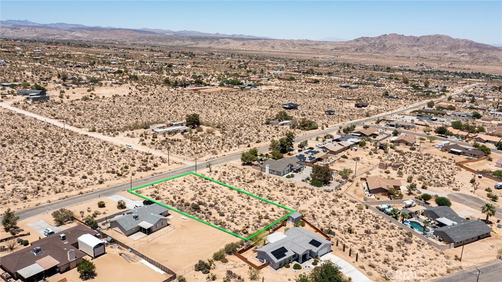 7800 Sunset Road Joshua Tree, CA 92252 - Photo 5 of 15 an aerial view of residential house and sandy dunes