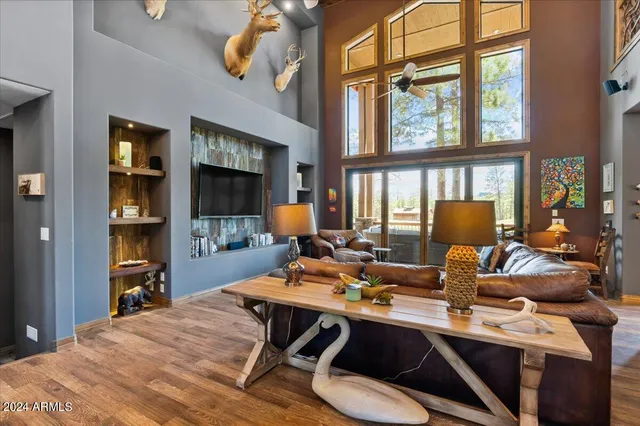 a view of living room with granite countertop furniture and wooden floor