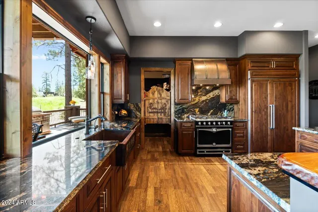 a living room with furniture ceiling fan and a window