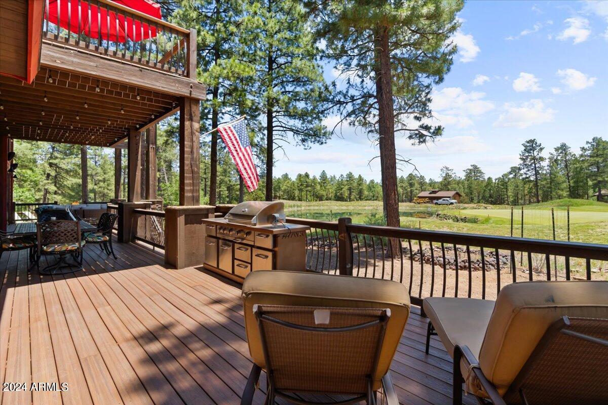 4051 West Falling Leaf Road Show Low, AZ 85901 - Photo 62 of 77 a view of a chairs and table on the deck