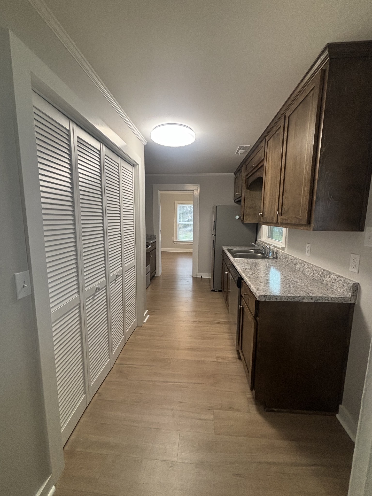 423 South Cedar Lane Pulaski, TN 38478 - Photo 6 of 9 a kitchen with stainless steel appliances granite countertop a sink a stove and a refrigerator