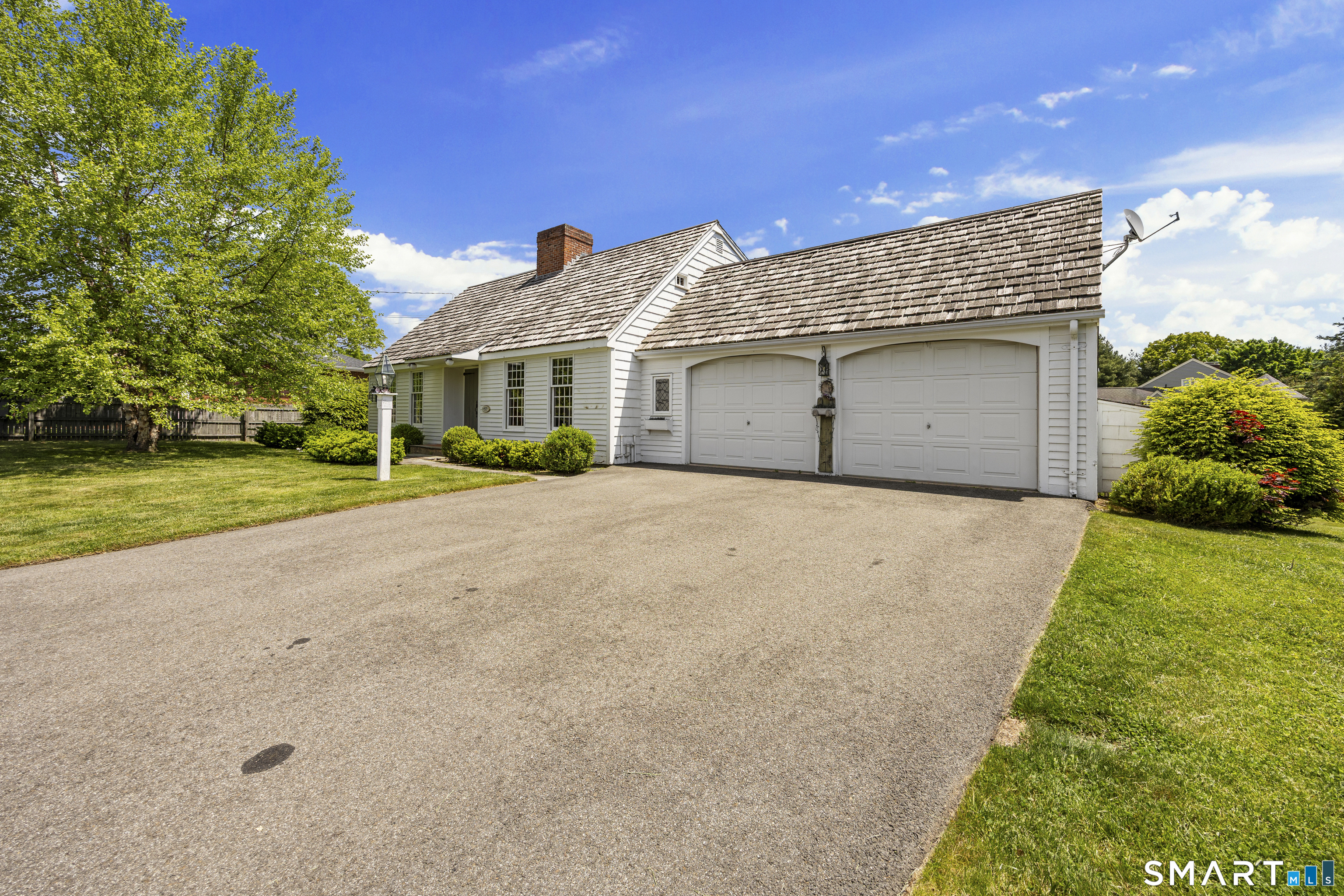 52 Susan Lane Meriden, CT 06450 - Photo 2 of 28 a front view of a house with a yard and garage