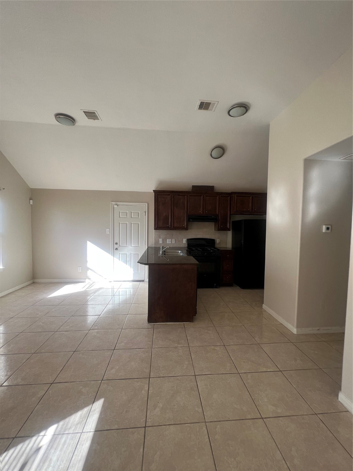 4221 Clover Street Houston, TX 77051 - Photo 3 of 6 a kitchen with granite countertop a rug and a refrigerator