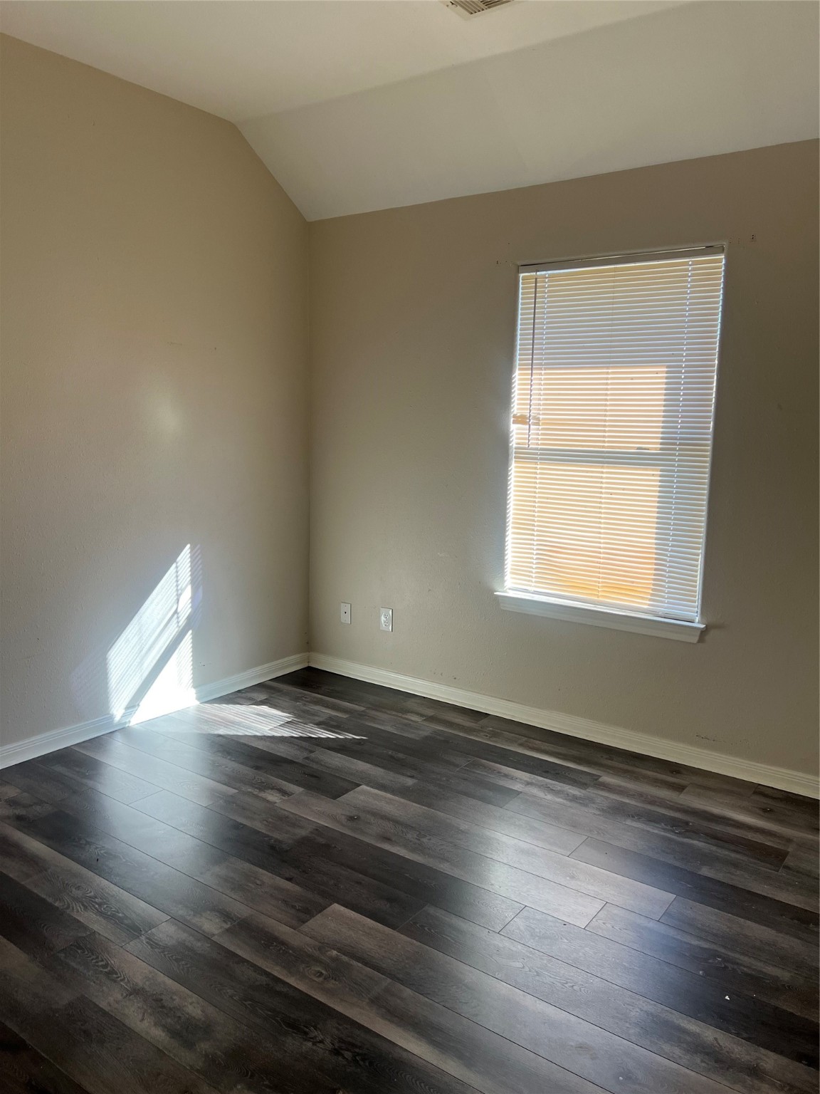 4221 Clover Street Houston, TX 77051 - Photo 4 of 6 a view of an empty room with wooden floor and a window