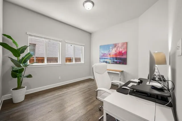 a workspace with furniture and wooden floor