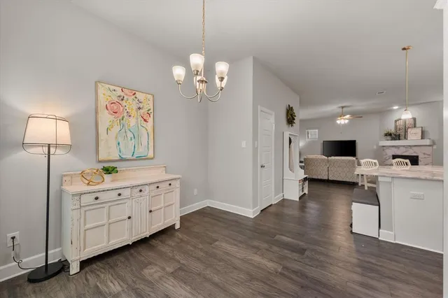 a view of a kitchen sink and dishwasher with wooden floor
