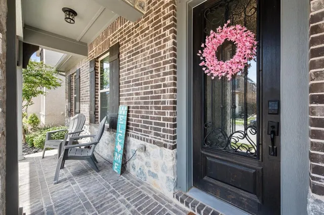 a front view of a house with outdoor seating