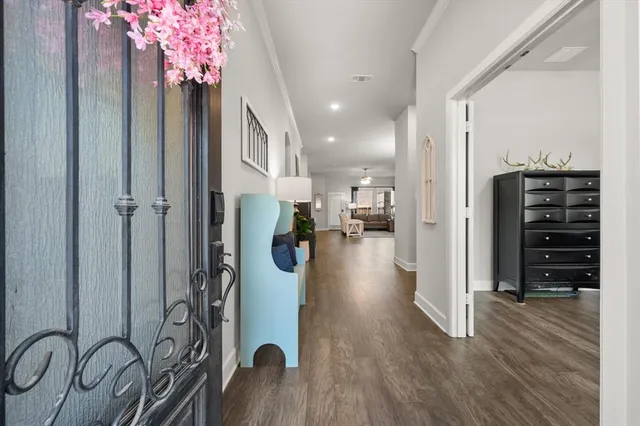 a view of entryway with a dining room and chandelier