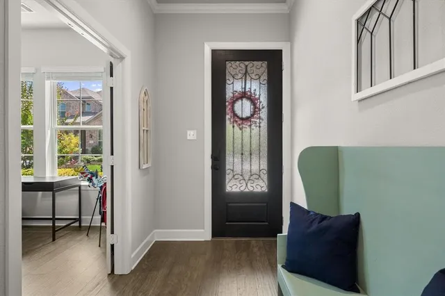 a view of a livingroom with furniture and a potted plant