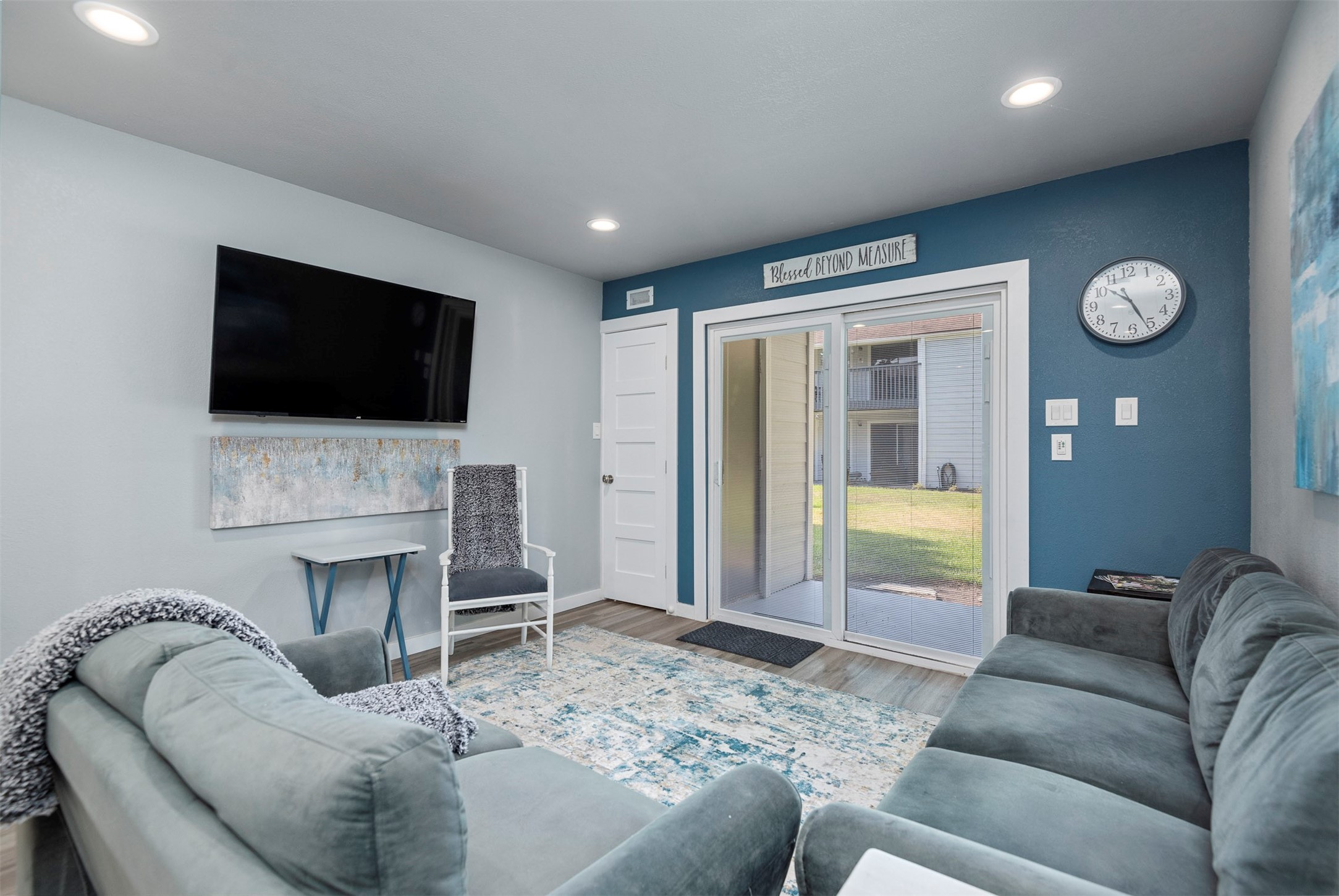 13151 Walden Road, Unit 195 Montgomery, TX 77356 - Photo 12 of 35 a living room with furniture and a flat screen tv